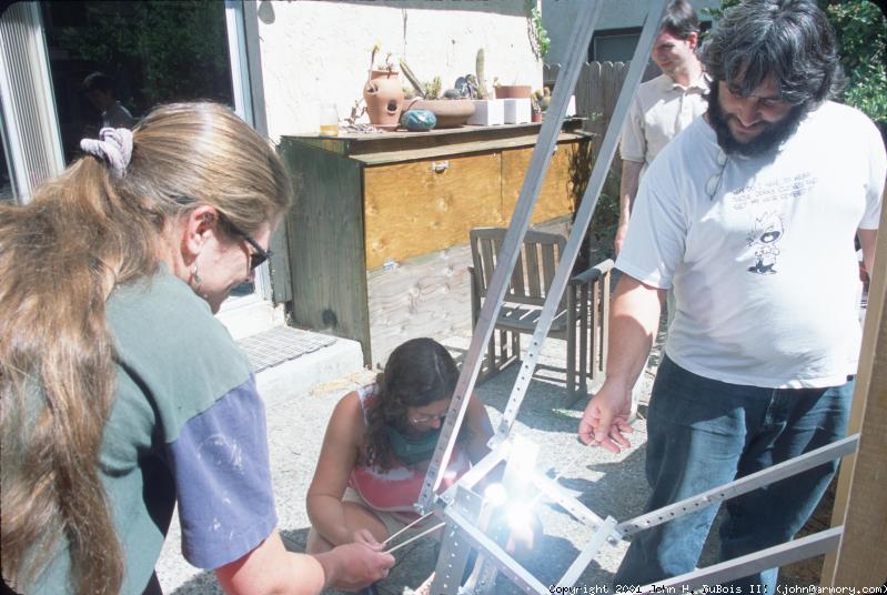 Liz, Irene, & Bela cooking marshmallows