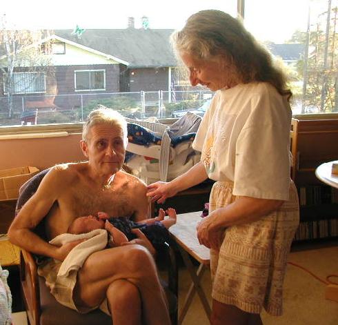 Eli holding Katie; Thelma Standing