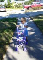 Walking his Toy Stroller